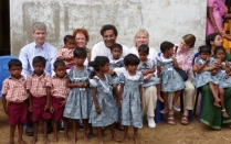 faculty with children in India. 