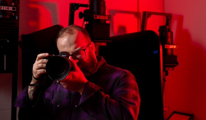 Rob Healy holding a camera.